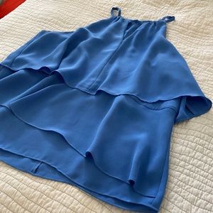 Vibrant sleeveless blouse from Saks